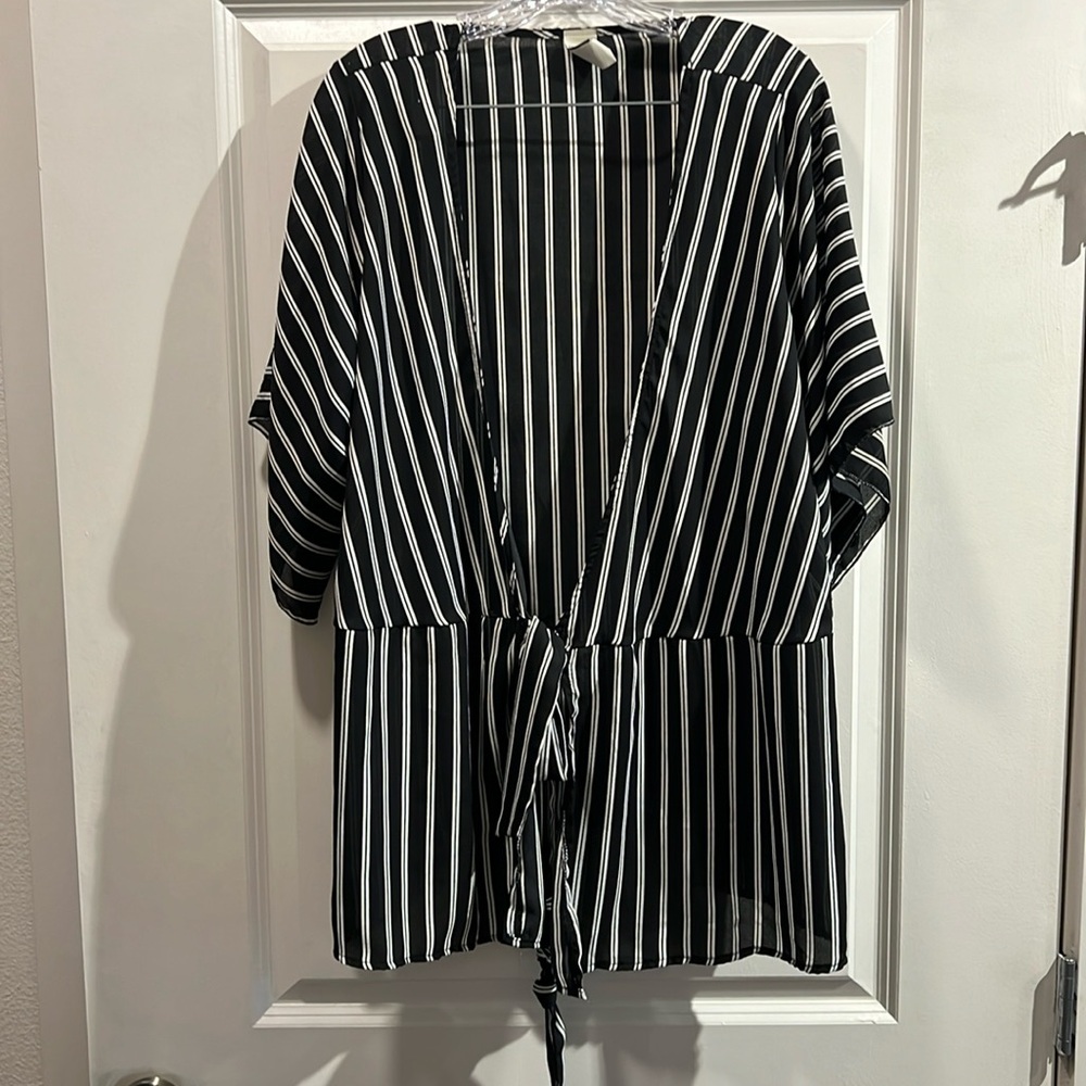 Oversized black and white striped top with tie.